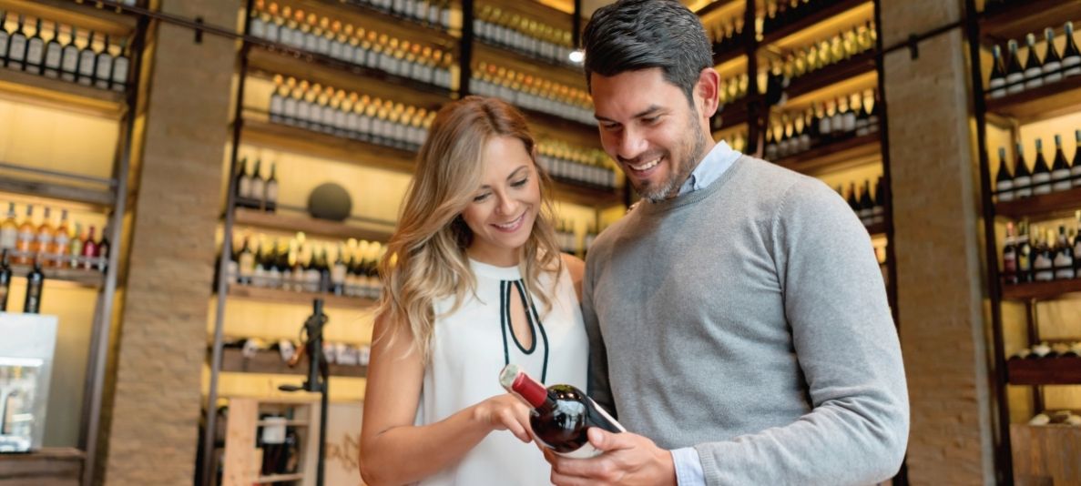 couple browsing wines at wine cellar